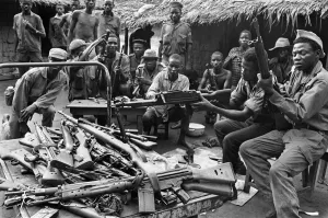 African Prints: Biafran soldiers seen here testing out a large stockpile of weapons during the conflict