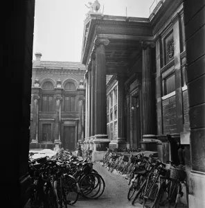 00266 Prints: Bicycles parked outside one of the University colleges in Oxford. Circa 1950