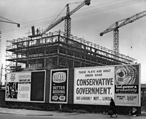 Scaffolding Prints: Billboard battlefield - While workmen hustle up Hulls tallest flats