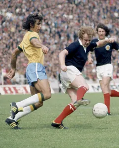 Billy Bremner in action against Wilson Piazza for Scotland in their World Cup match
