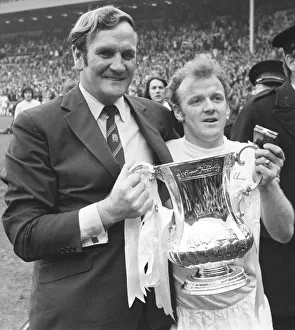 Arms Raised Prints: Billy Bremner Leeds United captain with manager Don Revie holding the F. A