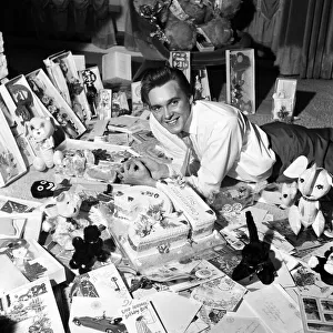Billy Fury singer on his 21st birthday April 1962 laying on floor wityh birthday