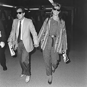 Holding Hands Prints: Billy Joel (musician) and his wife Christie Brinkley (model