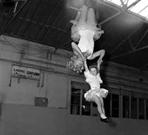 Billy Smarts Circus Trapeze artists swinging through the air December