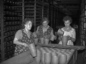 01186 Prints: Bilston Pottery 5th May 1958 Women in the drying room loading flower pots ready to