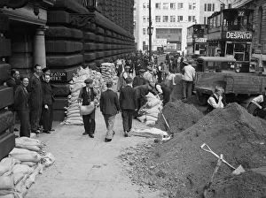 Birmingham City Council workmen seen here filling and sandbagging the City