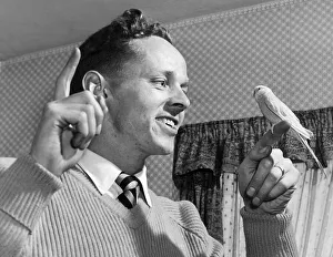 Birmingham City footballer Gordon Astall with a bird on his finger. 26th April 1958