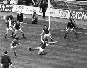 Birmingham Citys Gordon Taylor fires at the arsenal Goal despite a tackle from Alan