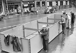 Birmingham council workmen construct an emergency water container in the city centre