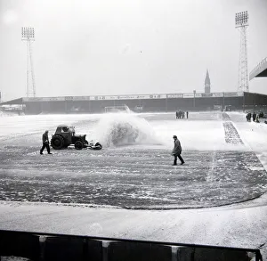 Groundsman Prints: Birmingham grounds staff seen here clearing snow from the pitch. January 1963