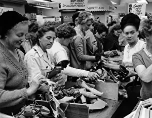 Birmingham Shopping Series. Customers looking at shoes on sale in Clark