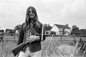 00530 Prints: Black Sabbath lead singer Ozzy Osbourne out with his shotgun at his Staffordshire home