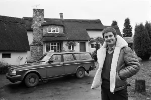 00530 Prints: Black Sabbath singer Ozzy Osbourne pictured outside his new house, beside his Volvo car