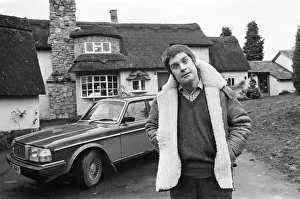 Black Sabbath singer Ozzy Osbourne pictured outside his new house, beside his Volvo car