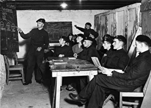Instruction Prints: Blackboard diagrams assist this class of members of a West Country Tank Corps unit in
