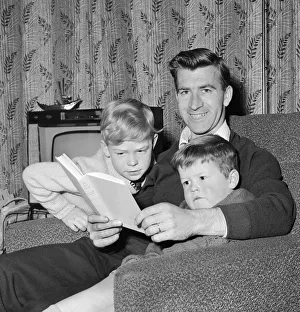 Blackburn Rovers footballer Bryan Douglas at home with his two boys. November 1963