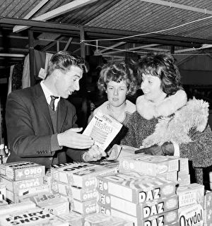 Blackburn Rovers footballer Bryan Douglas serving on his stall at the Morecambe market
