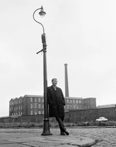00431 Prints: Blackburn Rovers forward John Byrom walking down the street where he lives