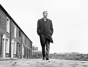 Blackburn Rovers forward John Byrom walking down the street where he lives