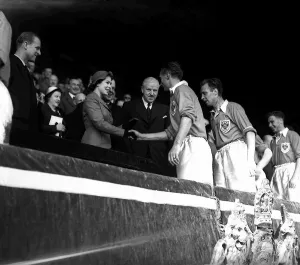 1953 Prints: Blackpool footballer Stanley Matthews shakes hands with Her Majesty Queen Elizabeth II