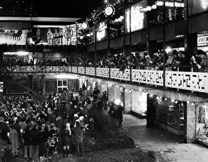 Lights Prints: The blaze of lights from shops adds to the sparkle of Christmas lights as families gather