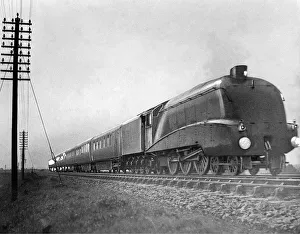 In a blinding rainstorm the Silver Jubilee engine Silver Link thunders along near