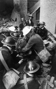 00075 Prints: Blitz, London. Girl is dragged from the rubble on Endell Street during the Second World