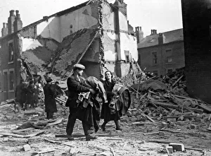 Blitz on a north west town. Retrieving personal belongings after their home had been