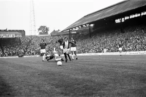 00469 Prints: Blues midfielder Gordon Taylor shows a clean pair of heels to Leicester quartet of Earle