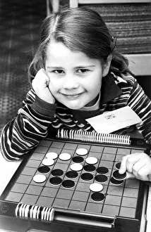 00101 Prints: The board game Othello is childs play to four year old Elizabeth Perella in April 1977
