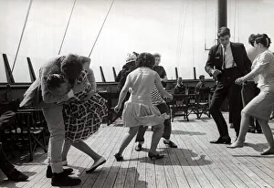 boat party - couples dance and jive in true 60s style Couple kissing