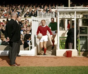 Bobby Charlton leads the Manchester United team out for a league division one match