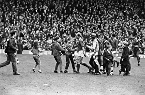 Queue Prints: Bobby Charlton leaving the pitch at Old Trafford with young fans rushing to shake his