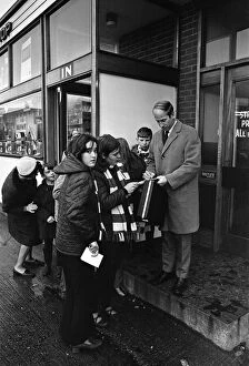 01247 Collection: Bobby Charlton is met by autograph hunters as he leaves Old Trafford for London
