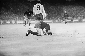 Number Prints: Bobby Charlton walks off into the distance leaving Mexico captain Gustavo Pena