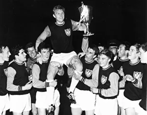 Bobby Moore captain of West Ham United 1965 with teammates after winning
