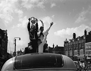Bobby Moore holds up the FA Cup during the parade around East London after the Hammers