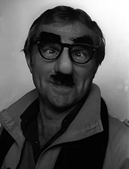 Disguise Prints: Bobby Moore wearing a Colonel Blimp mask photographed in the Daily Mirror studio