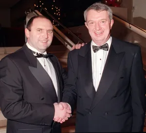 Promoter Prints: Bobby Williamson Kilmarnock manager December 1998 shakes hands with boxing promoter Tommy