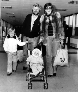 Bobby Willis husband of singer Cilla Black with their children at London airport