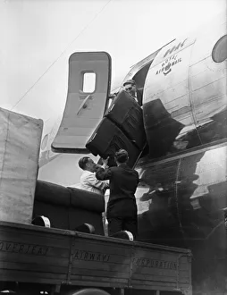 BOCA Boeing Strato Cruiser being adapted and loaded with supplies for flood victims in