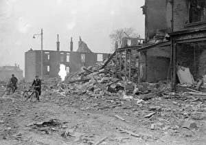 Bomb damage at Glasgow Clydeside, two boys runs for safety during the blitz