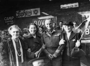 01471 Prints: Bombardier M. Simons of Cardiff pictured with his wife and mother after his return