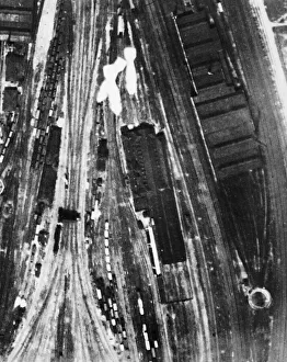 Bombs Prints: Bombs from a Bristol Blenheim of No. 2 Group fall over the junction of the main lines