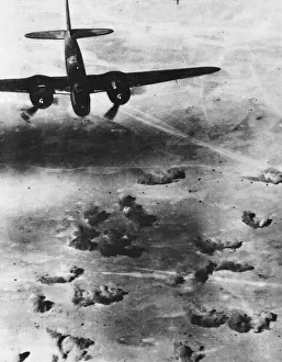 Bombs bursting among fleeing German vehicles in the Western Desert