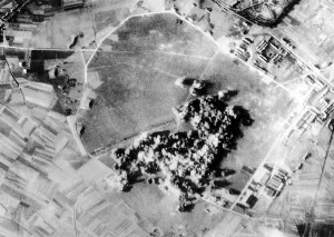 00152 Prints: Bombs exploding on a Nazi aircraft engine plant near Brussels in Belgium