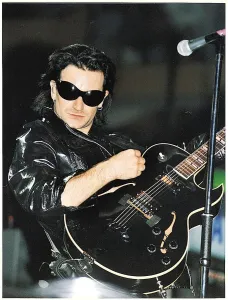 Gibson Prints: Bono of the pop group U2 performing on stage at Celtic Park in Glasgow during their ZOO