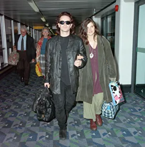Bono of rock group U2 and his wife Ali pictured at London Airport. 10th October 1991
