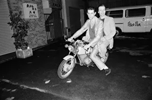 Japan Prints: The Boomtown Rats in Tokyo. Pictured, singer Bob Geldof and Garry Roberts on a motorbike