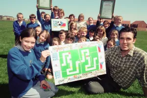 Board Games Prints: Former Boro player Bernie Slaven with Katie McCormick and class at St Dominic